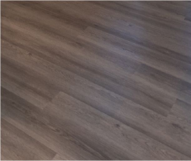 Acclaim at the Hill senior apartment homes with Brown wood grain laminate flooring with a smooth, matte finish and subtle variations in color.